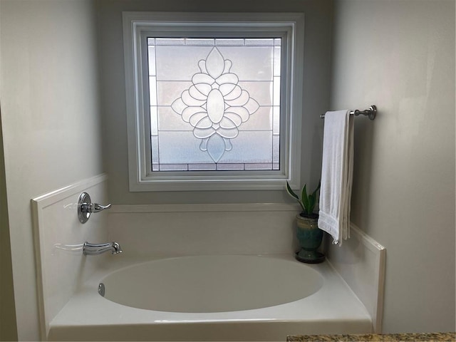 full bathroom with a garden tub