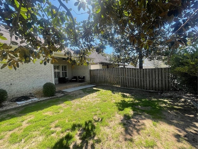 view of yard featuring a patio area and fence