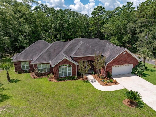 view of front of property with a garage and a front lawn