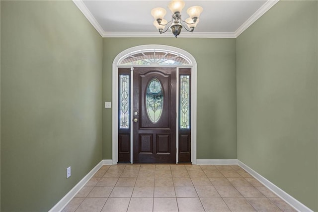 tiled entryway with crown molding and a chandelier