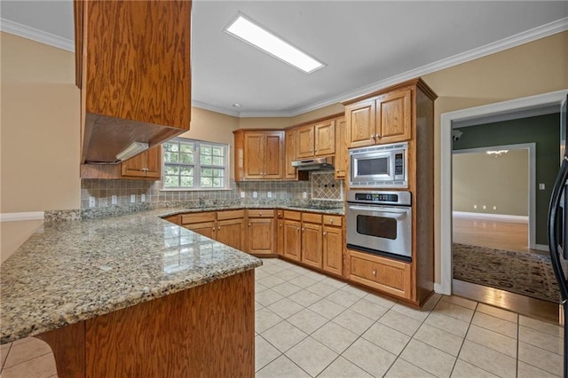 kitchen featuring light stone counters, crown molding, stainless steel appliances, and kitchen peninsula