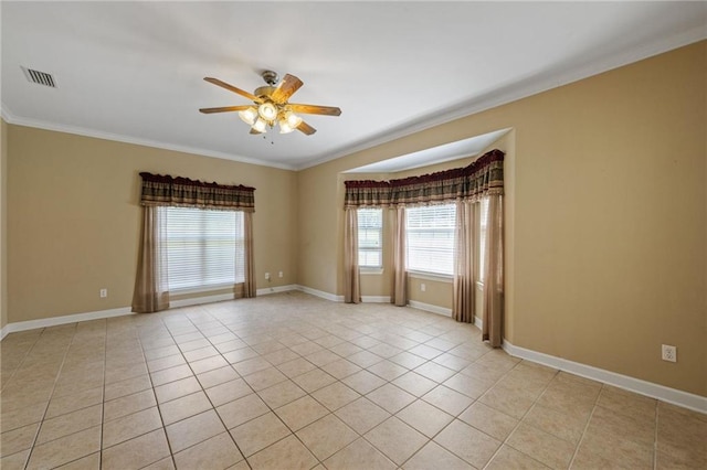 tiled empty room with crown molding and ceiling fan