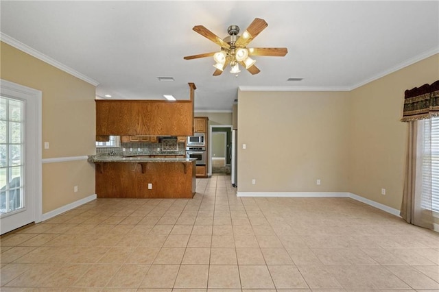 kitchen featuring tasteful backsplash, ornamental molding, stainless steel appliances, and kitchen peninsula