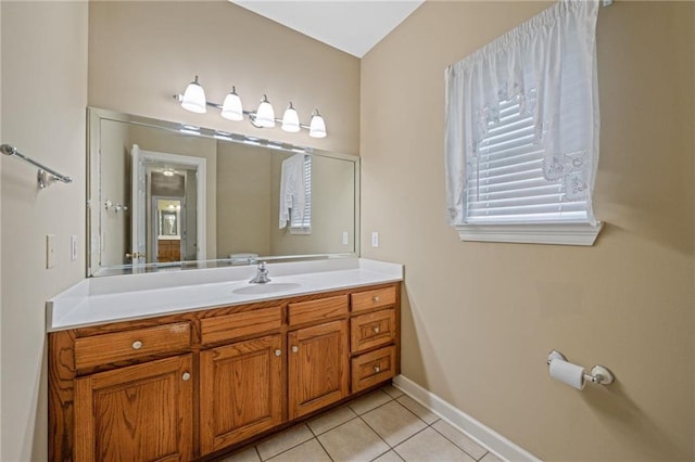 bathroom featuring tile patterned flooring and vanity