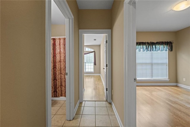 hallway with light tile patterned flooring