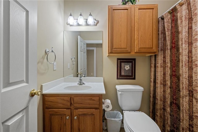 bathroom with vanity and toilet