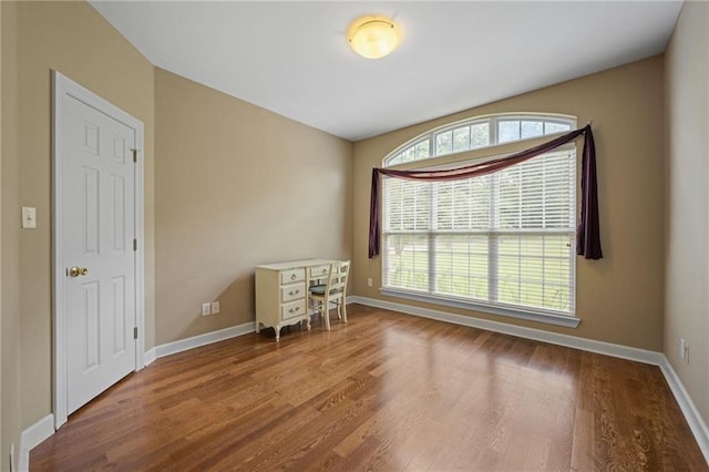 spare room featuring hardwood / wood-style flooring