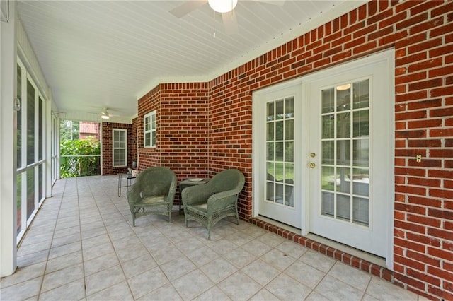 view of patio featuring ceiling fan and french doors