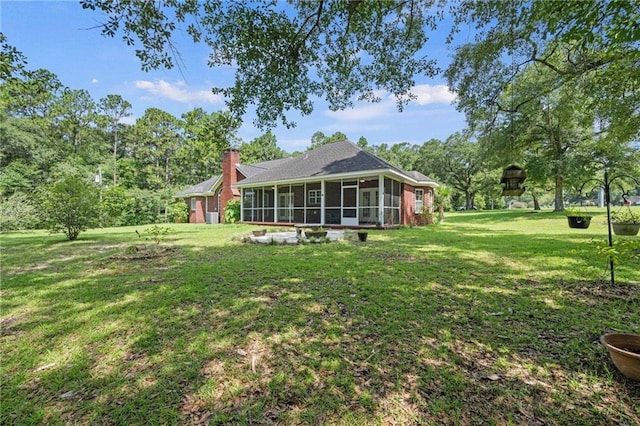 view of yard with a sunroom