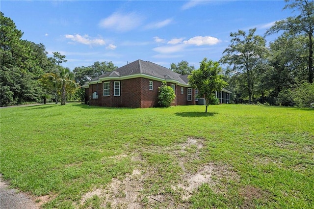 view of yard with central AC