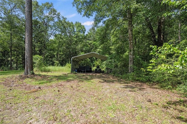 view of yard with a carport