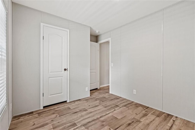 unfurnished bedroom with light hardwood / wood-style floors