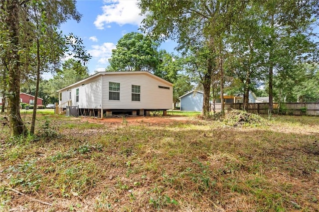 view of home's exterior with a garage and an outdoor structure