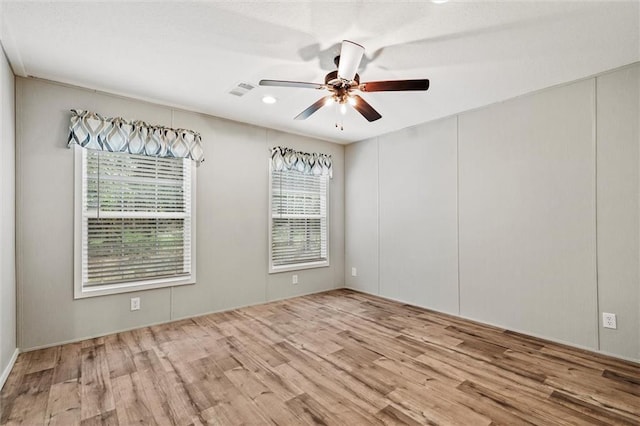 spare room with ceiling fan and light hardwood / wood-style floors