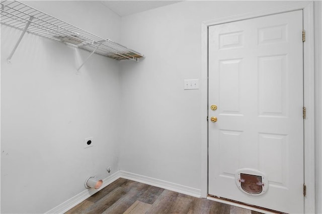 laundry room featuring electric dryer hookup, dark hardwood / wood-style flooring, and hookup for a gas dryer