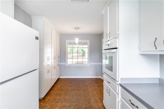 601 Willow Brook Run E, Mobile, AL 36608 - kitchen with white appliances, white cabinets, and hanging light fixtures
