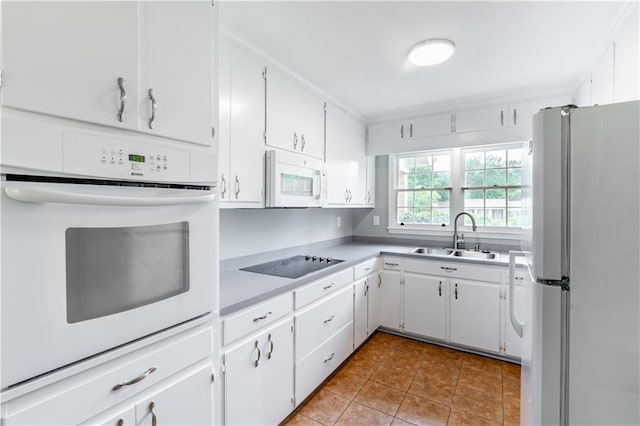 601 Willow Brook Run E, Mobile, AL 36608 - kitchen with white appliances, tile patterned flooring, and white cabinetry