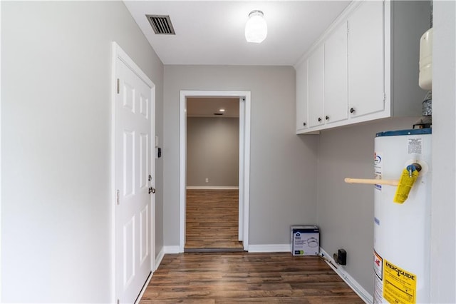601 Willow Brook Run E, Mobile, AL 36608 - laundry room with water heater, dark wood-style flooring, and cabinet space