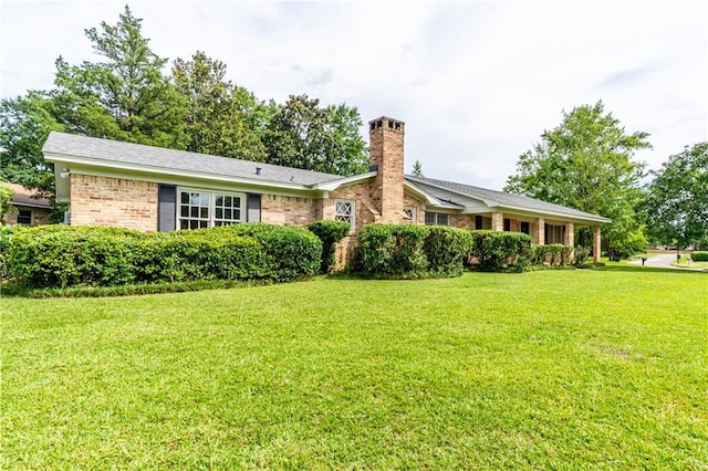 601 Willow Brook Run E, Mobile, AL 36608 - view of front of home featuring a chimney, a front lawn, and brick siding