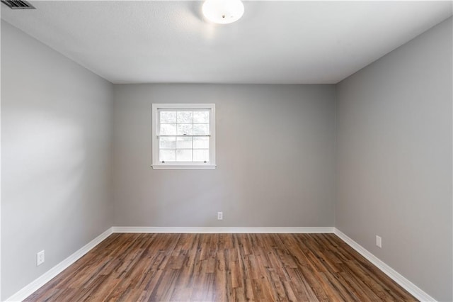 601 Willow Brook Run E, Mobile, AL 36608 - unfurnished room with dark wood-style floors and baseboards