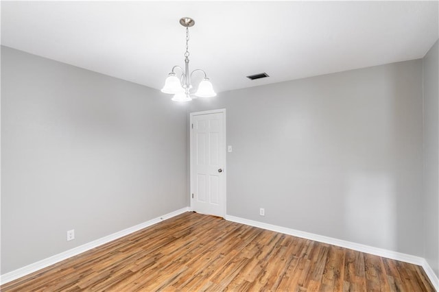 601 Willow Brook Run E, Mobile, AL 36608 - empty room with a chandelier and light wood-style floors