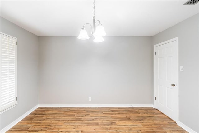 601 Willow Brook Run E, Mobile, AL 36608 - spare room with a chandelier and light wood-style floors