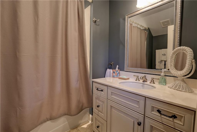 bathroom with shower / bath combination with curtain and vanity