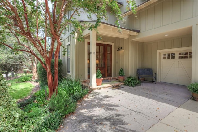 view of exterior entry featuring a garage