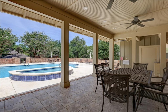 exterior space featuring ceiling fan and a swimming pool with hot tub