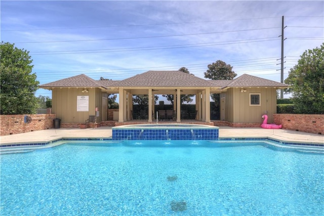 view of swimming pool featuring a patio and pool water feature