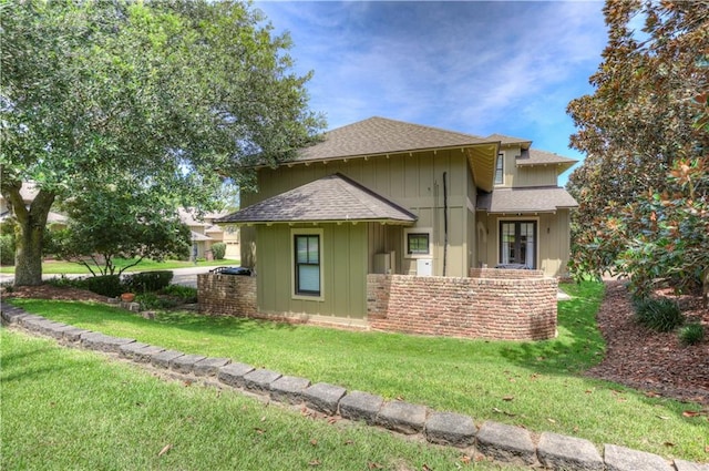 view of property exterior featuring a lawn