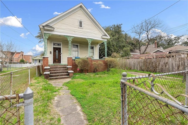 bungalow-style home featuring a front yard and a porch