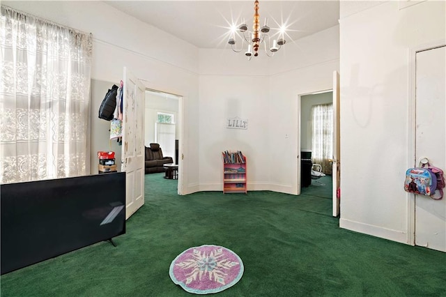 interior space featuring a notable chandelier and dark colored carpet