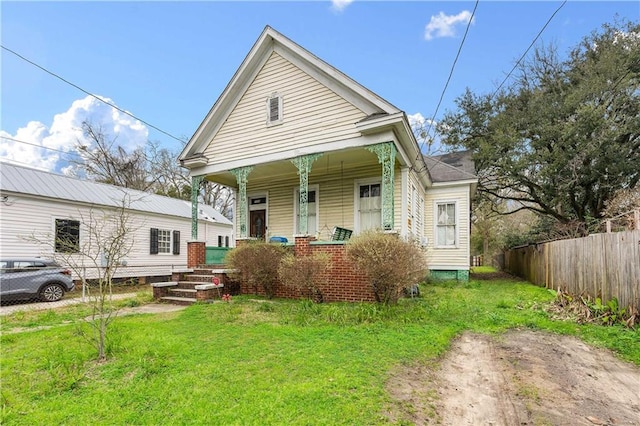 bungalow-style home with a front yard and a porch