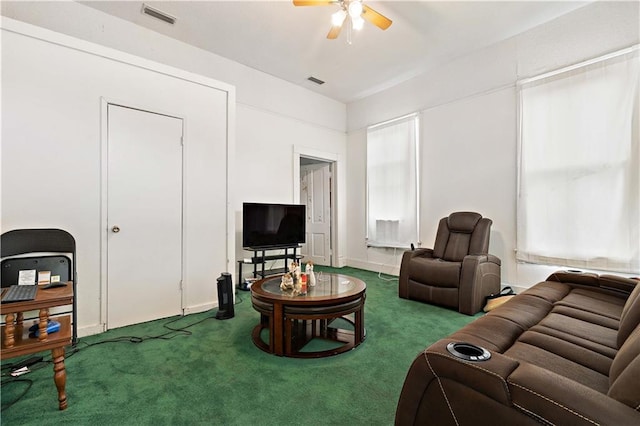 carpeted living room featuring ceiling fan