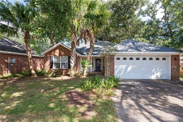 single story home featuring a garage, brick siding, driveway, and roof with shingles