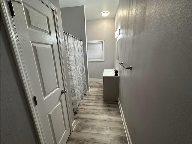 bathroom featuring vanity and hardwood / wood-style floors