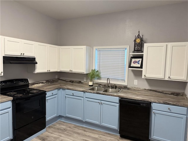 kitchen with white cabinets, sink, light hardwood / wood-style flooring, and black appliances