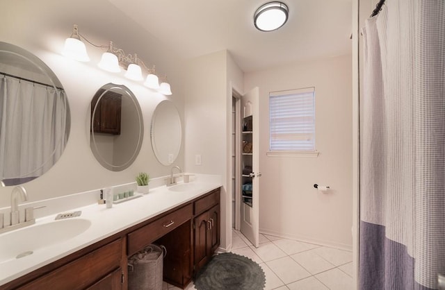 full bathroom with a sink, double vanity, a shower with curtain, and tile patterned floors