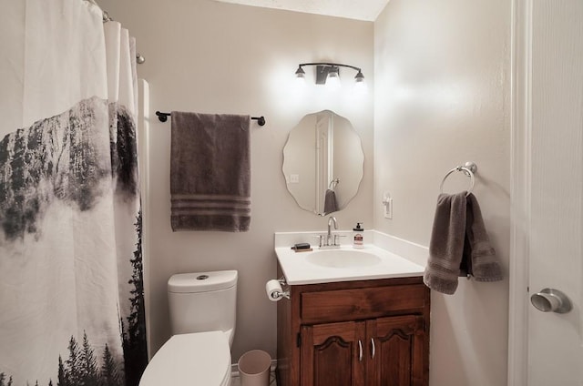 bathroom with vanity, toilet, and a shower with curtain