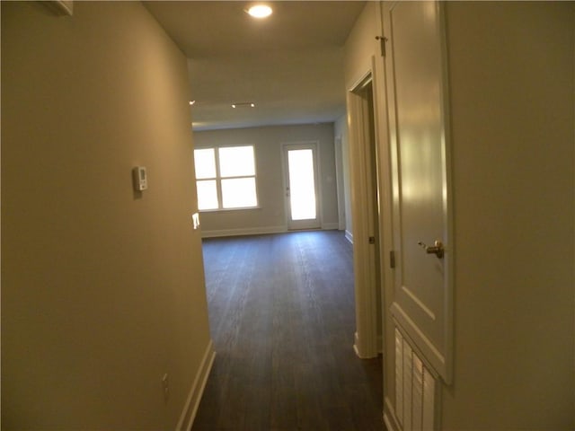 hallway with dark hardwood / wood-style floors