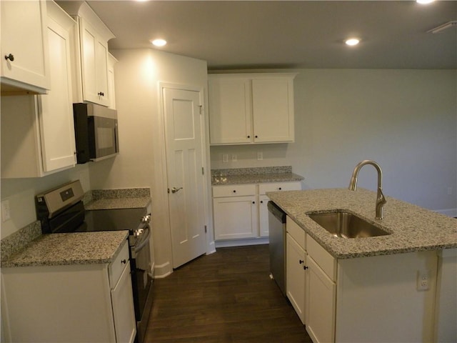 kitchen featuring light stone counters, sink, white cabinets, and appliances with stainless steel finishes