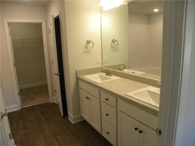 bathroom with vanity and hardwood / wood-style flooring