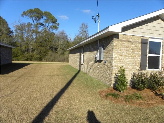 view of property exterior with a yard