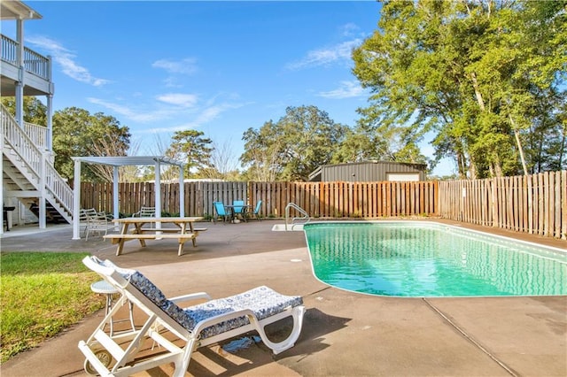 view of swimming pool featuring a patio