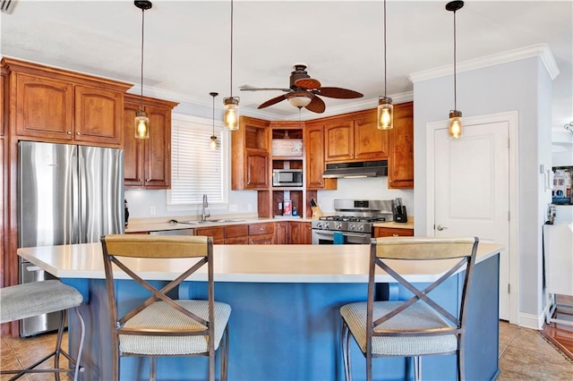 kitchen with a kitchen breakfast bar, hanging light fixtures, a center island, and stainless steel appliances