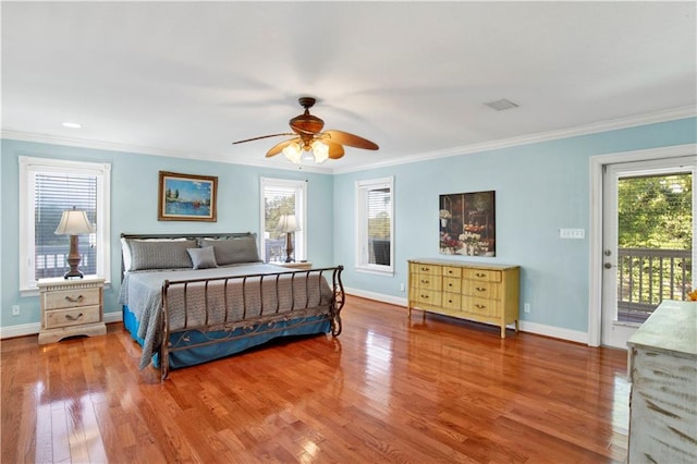 bedroom featuring hardwood / wood-style flooring, ceiling fan, access to exterior, and crown molding