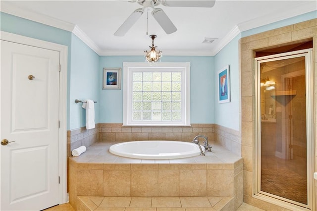 bathroom featuring plus walk in shower, ceiling fan, and ornamental molding