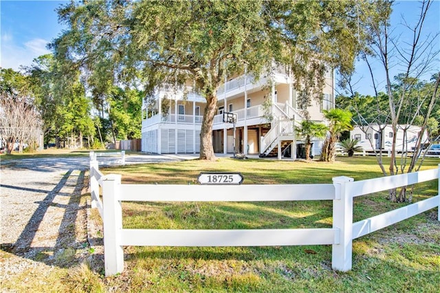 view of front of house with a garage and a front yard