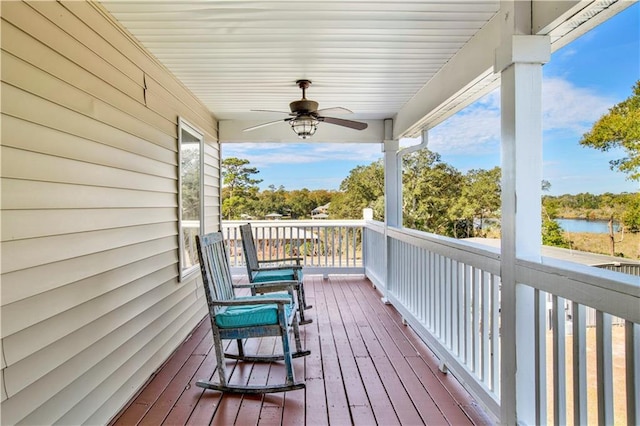 wooden terrace featuring ceiling fan